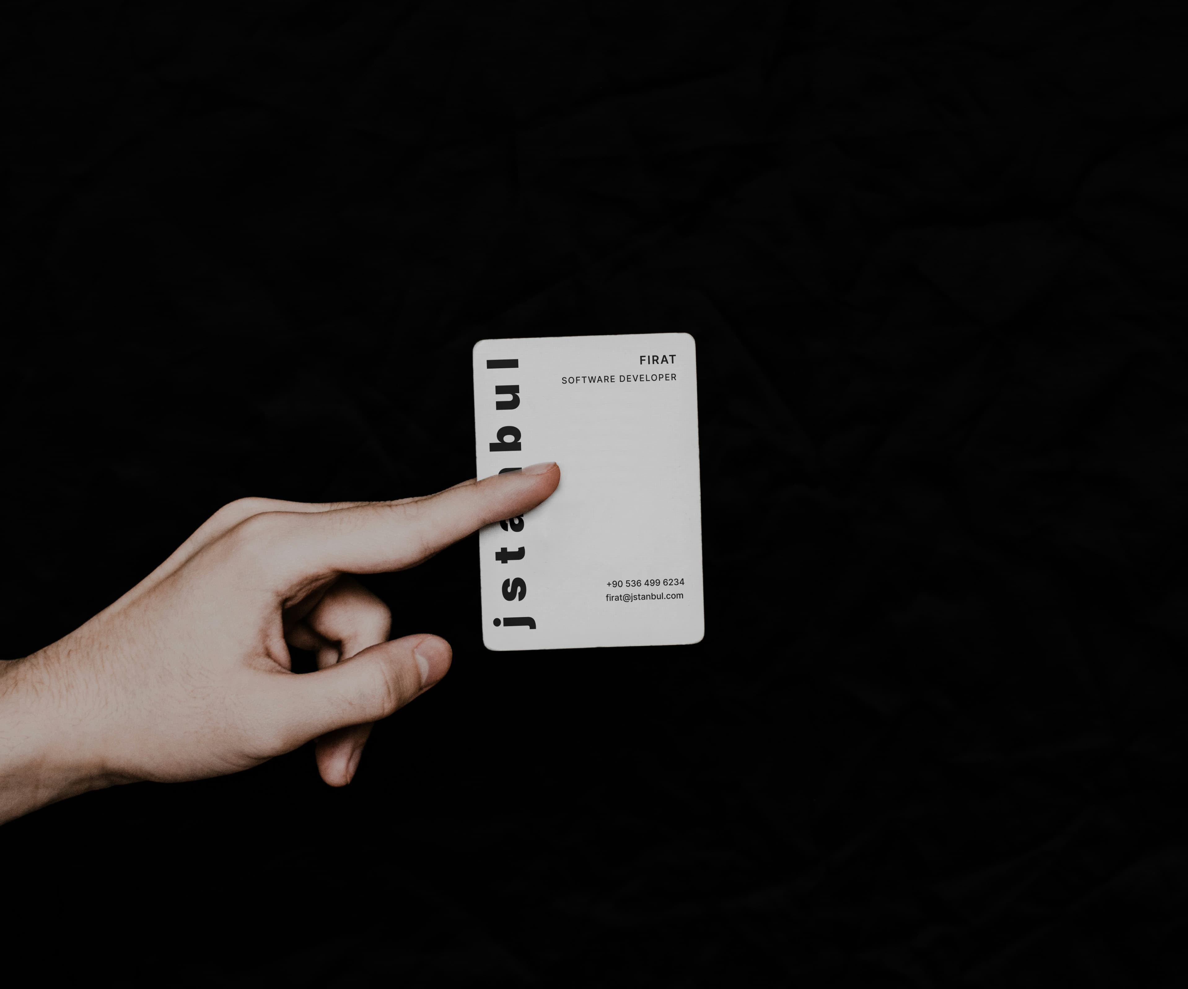 A jstanbul business card resting on a textured surface